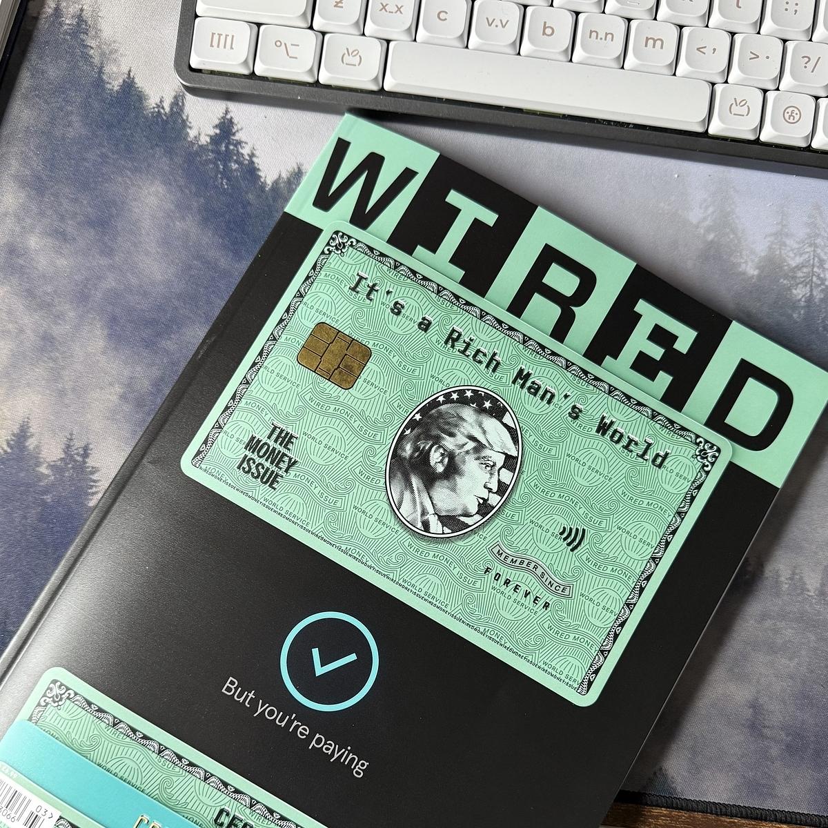 A Wired magazine cover features a theme of money with an altered credit card design and the text "It's a Rich Man's World."