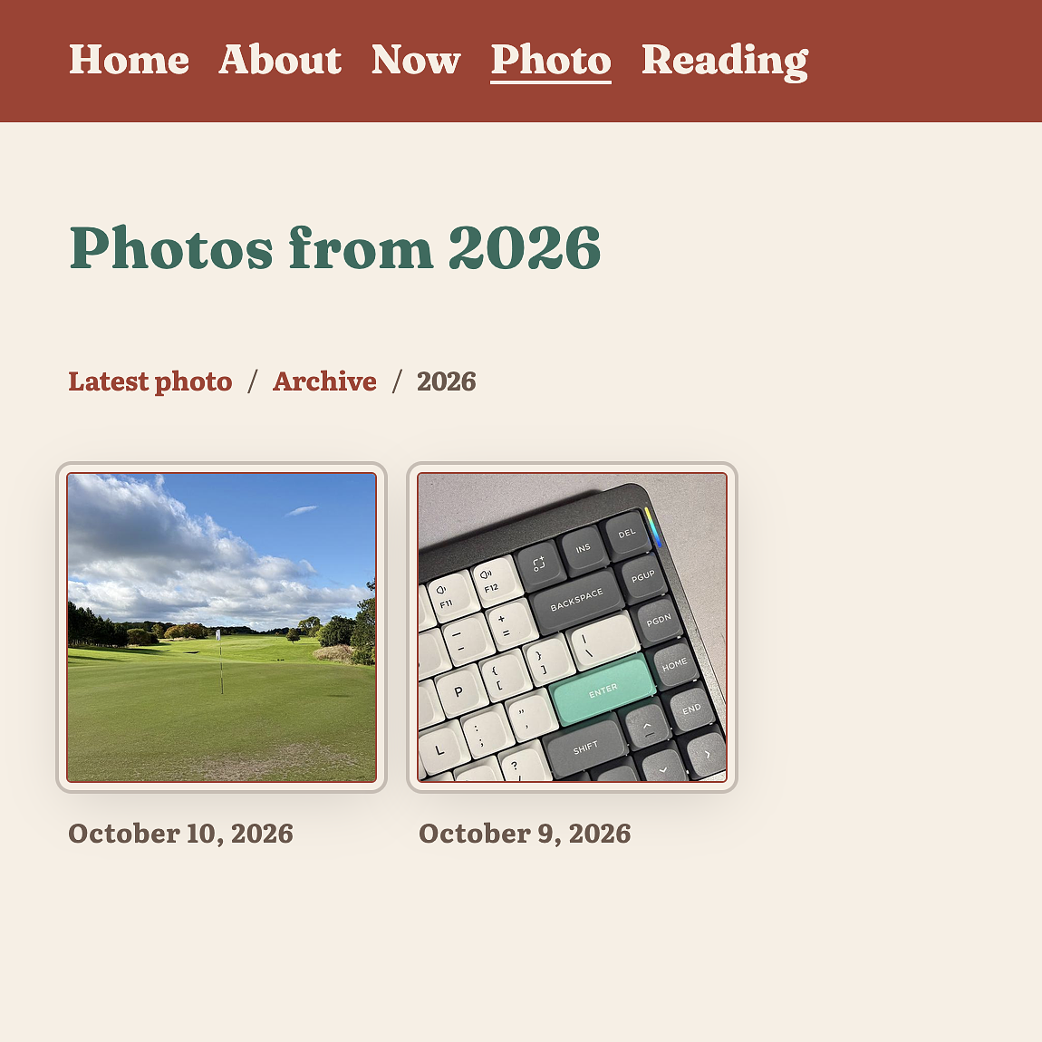 A photo archive page from 2026 showing two thumbnail images: a golf course on October 10 and a mechanical keyboard on October 9.