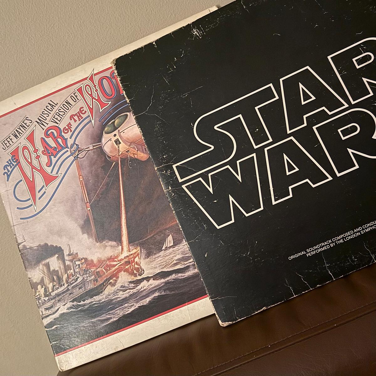 Two vintage record albums are shown: one is of Jeff Wayne’s War of the Worlds and the other is the Star Wars soundtrack.
